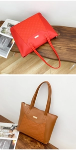 Detail of red and brown quilted tote bags with elegant flower zipper charms