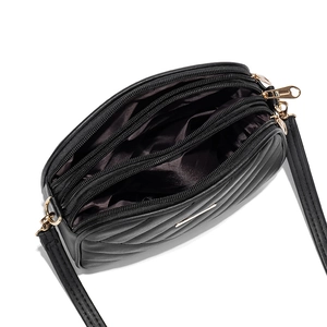 Chic black quilted crossbody bag with three golden zippers and spacious compartments