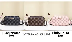 Three embroidered camera bags in black, coffee, and pink with adjustable wide straps