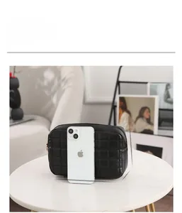Quilted crossbody bag dimensions 20cm x 14cm x 6cm shown with smartphone for size reference