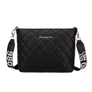 Black quilted crossbody bucket bag with Serenity logo and patterned wide strap