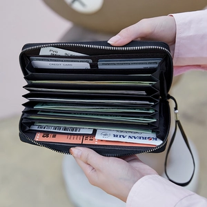 Black long leather wallet with multi-card slots and secure zipper closure for women