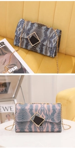 Detail showing snake print texture and gold chain strap on stylish gradient crossbody bags
