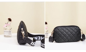 Detail of black quilted crossbody bag with gold hardware and stylish lettered strap