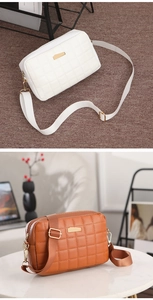 Close-up of quilted PU leather crossbody bags in white and brown with gold hardware