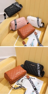Close-up of quilted crossbody bags in four colors with wide embroidered guitar straps