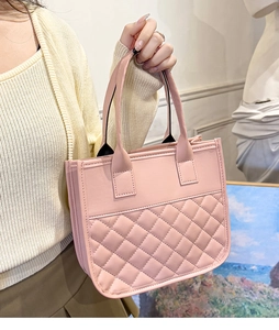 Detail of pink quilted tote bag with diamond stitching and elegant soft PU leather handles