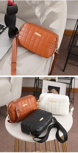 Detailed view of quilted camera bags in three colors with stylish gold hardware and fabric straps