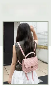 Classic pink quilted leather backpack for women with metal twist lock detail
