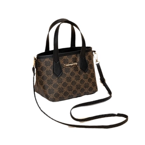 Retro-Handtasche mit floralem Druck in Braun mit schwarzem Griff und Goldlogo