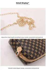 Close-up of brown floral pattern mini crossbody bag with gold chain strap and metal zipper