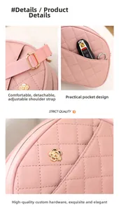 Detail of pink quilted messenger bag showing golden camellia buckle and adjustable strap