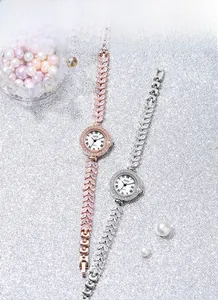 Macro shot of GEDI jewelry watches with crystal leaf bracelets and pearl background