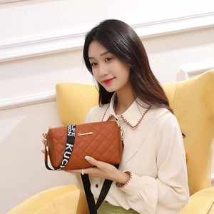 Brown quilted leather crossbody bag for women with stylish lettered woven shoulder strap