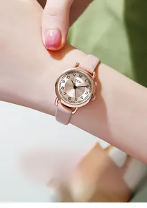 Close-up of GEDI ladies' watch with rose gold case and pink leather strap worn on wrist