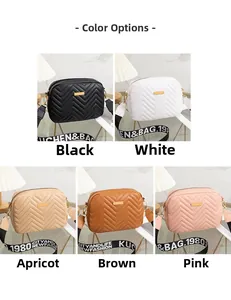 Detailed close-up showing five colors of quilted crossbody bags with wide fabric straps