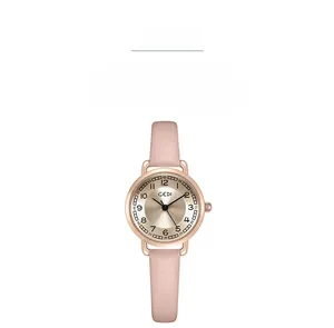 Detail of rose gold watch case with champagne dial and pink leather strap