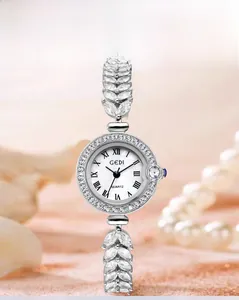 Detailed view of GEDI silver quartz watch with diamond bezel and leaf shaped strap links