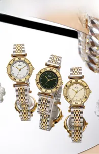 Three Gedi quartz watches with gold-silver straps and Roman numerals on reflective background