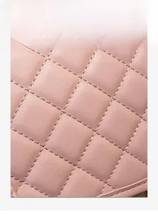 Detailed close-up of pink quilted fabric texture on a woman's fashion backpack