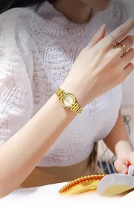 Close-up of GEDI ladies vintage quartz watch with gold textured dial and chain bracelet