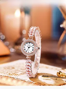 Detail of the elegant wheat ear shaped crystal strap and diamond bezel of the ladies watch