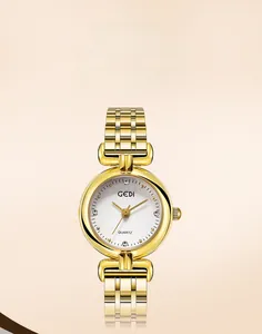 Detail of GEDI gold quartz watch with white textured dial and sparkling rhinestones