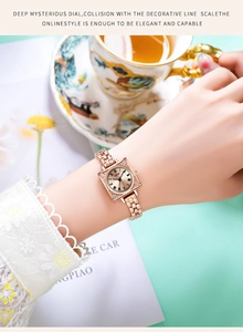 Detail of GEDI rose gold square watch with crystal accents on a model's wrist