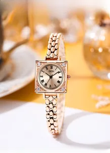 Detailed view of GEDI square quartz watch with rose gold beaded chain and Roman numerals
