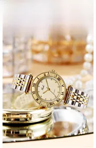 Close-up of a vintage quartz watch with champagne checkered dial and Roman numerals