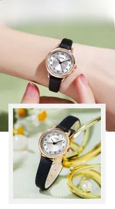Detail of GEDI small dial quartz watch with rose gold case and black leather strap