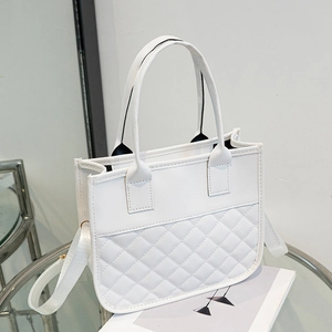 Elegant white quilted tote bag with dual handles and adjustable fabric strap