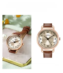 Detail of GEDI vintage quartz watch with rose gold case and brown leather strap