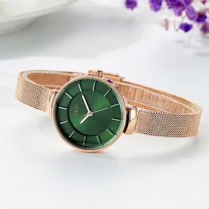 Elegant rose gold mesh strap watch with a deep green sunburst dial and minimalist markers