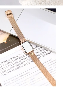 Detailed macro shot of the engraved GEDI stainless steel back and rose gold mesh strap