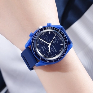 Close-up of blue silicone sports chronograph watch with tachymeter and quartz movement