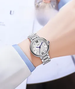 Detailed close-up of GEDI women's steel watch featuring blue hands and silver band
