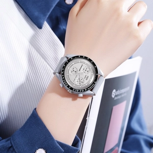 Detailed close-up of a grey silicone sports watch with chronograph sub-dials and tachymeter