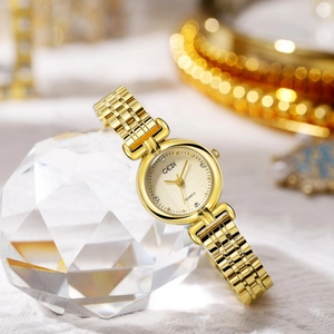 Elegant gold-tone women's quartz watch with textured champagne dial and link bracelet