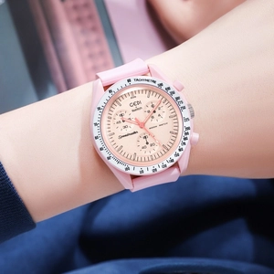 Close-up of pink sporty chronograph watch with silicone strap and tachymeter bezel