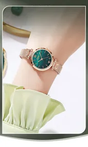 Close-up of GEDI women's watch with green malachite dial and rose gold mesh strap