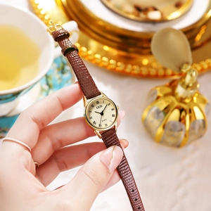 Montre GEDI vintage dorée pour femme avec bracelet en cuir serpent marron et cadran romain