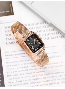 Detail of GEDI rectangular watch with black sunburst dial and rose gold mesh strap