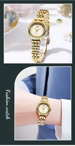 Detail of elegant gold octagonal quartz watch with diamond markers and 5-link strap