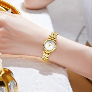 Elegant gold quartz watch for women with textured metal strap and diamond-accented dial