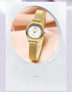 Macro view of Gedi gold mesh strap watch with octagonal case on pink silk fabric