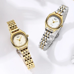 Close-up of Gedi quartz watches with luxury five-link metal straps in gold and silver finish