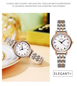 Dettaglio orologio da donna con indici in cristallo colorato e cinturino in acciaio bicolore