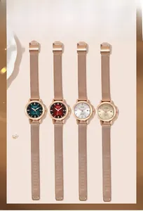 Detail showing quartet of quartz watches with rhinestone markers and mesh steel straps