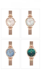 Close-up of four luxury women's watches with mother-of-pearl dials and rose gold mesh straps